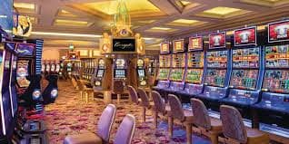 Filipino sports fan watching a basketball game and placing a live bet on perya plus